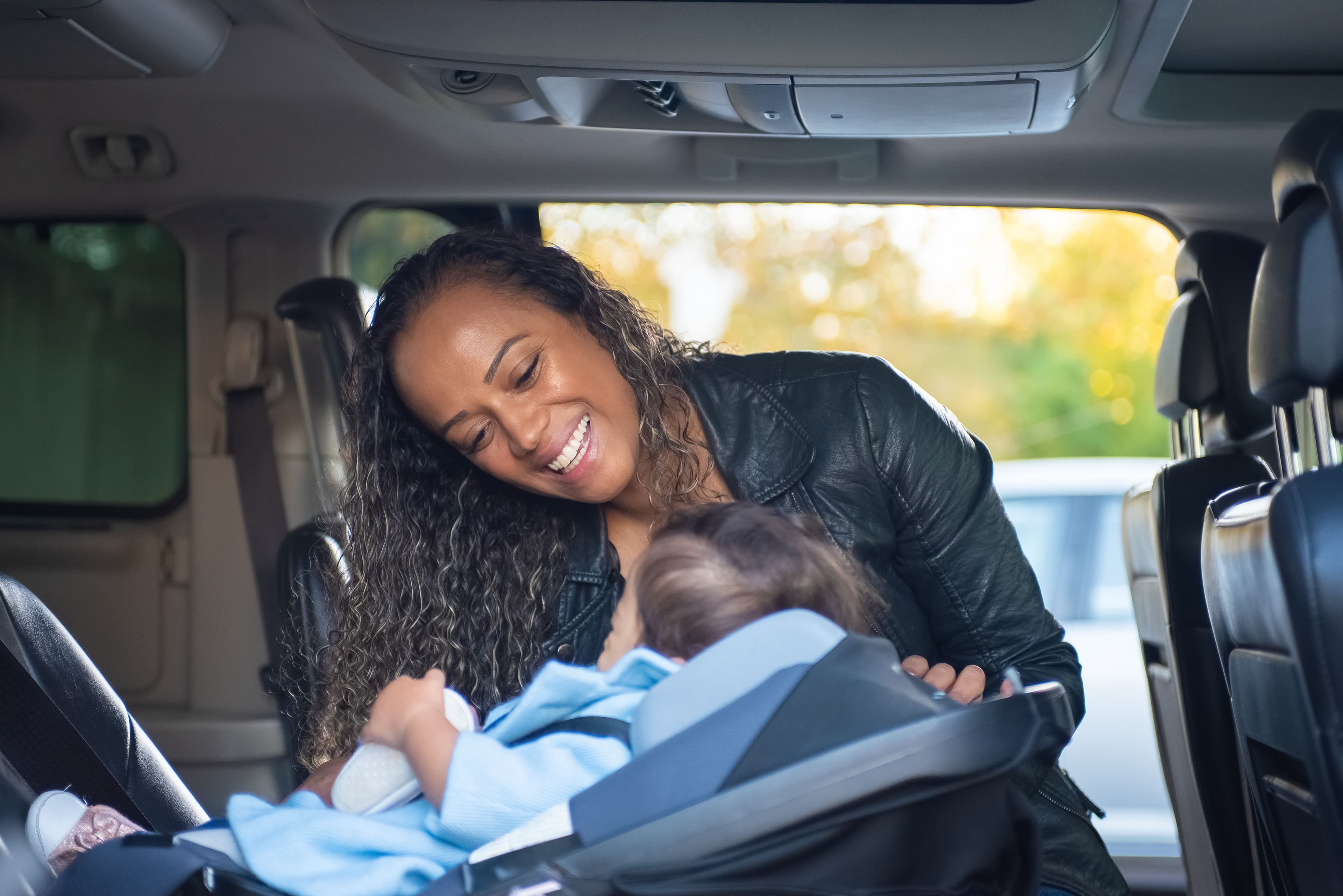 Young child sitting safely in a car seat — BabyCosts Australia