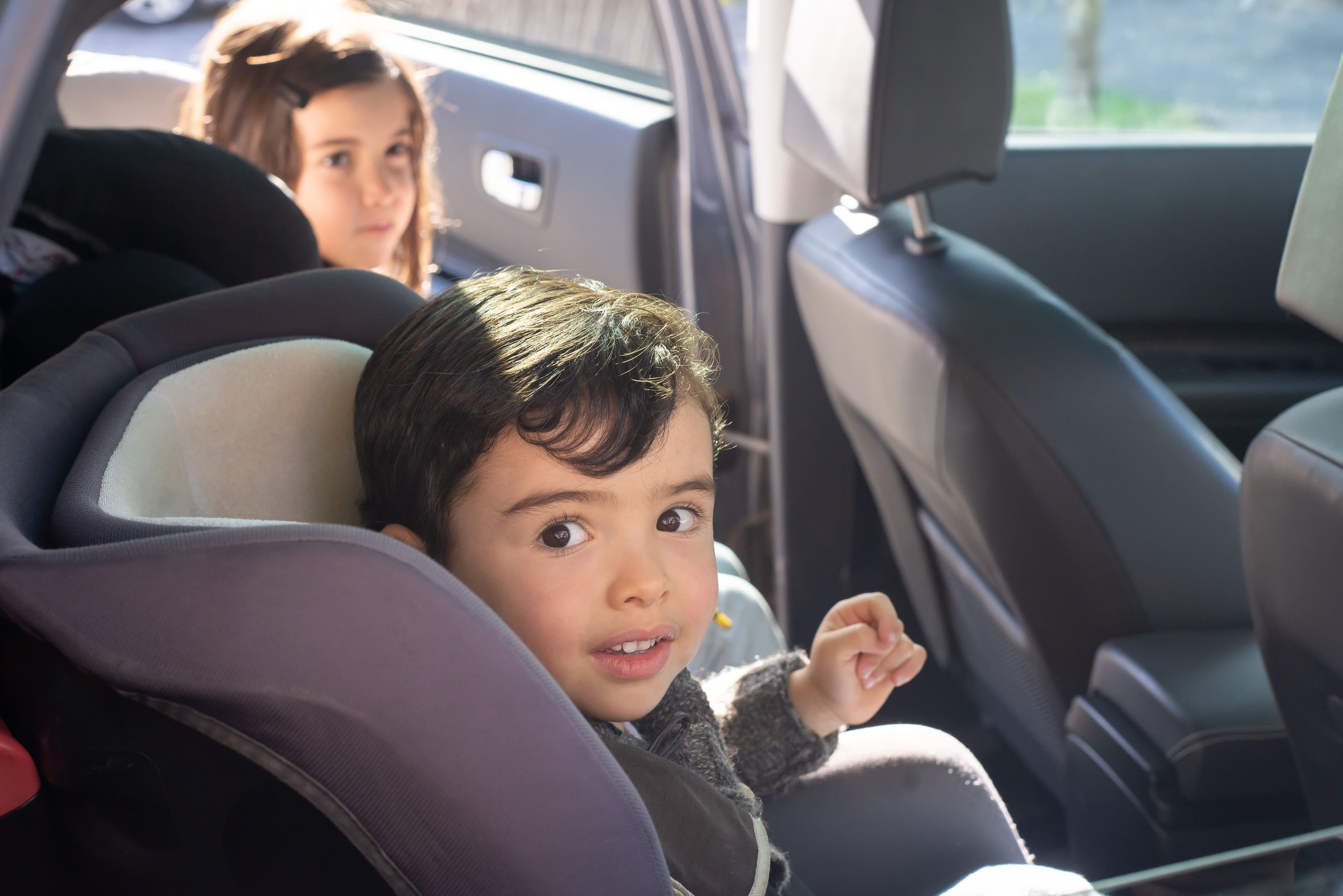 Young child sitting safely in a car seat — BabyCosts Australia