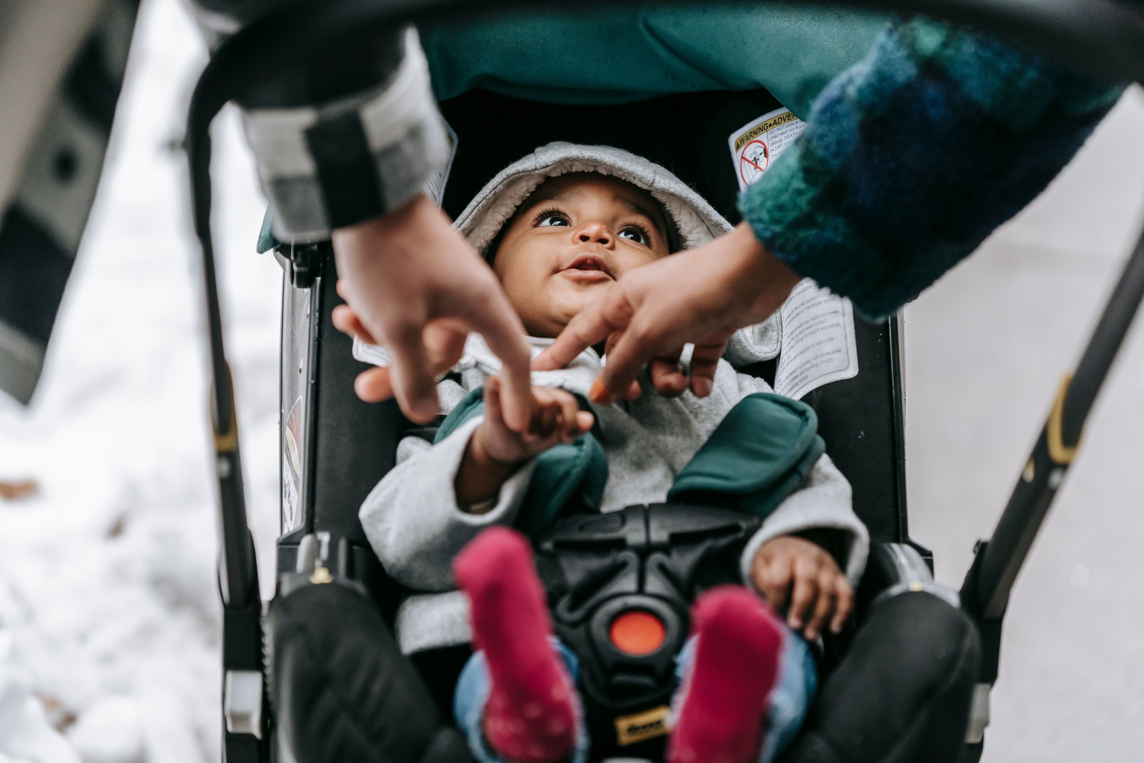Mother and baby sharing a joyful moment outdoors — BabyCosts Australia