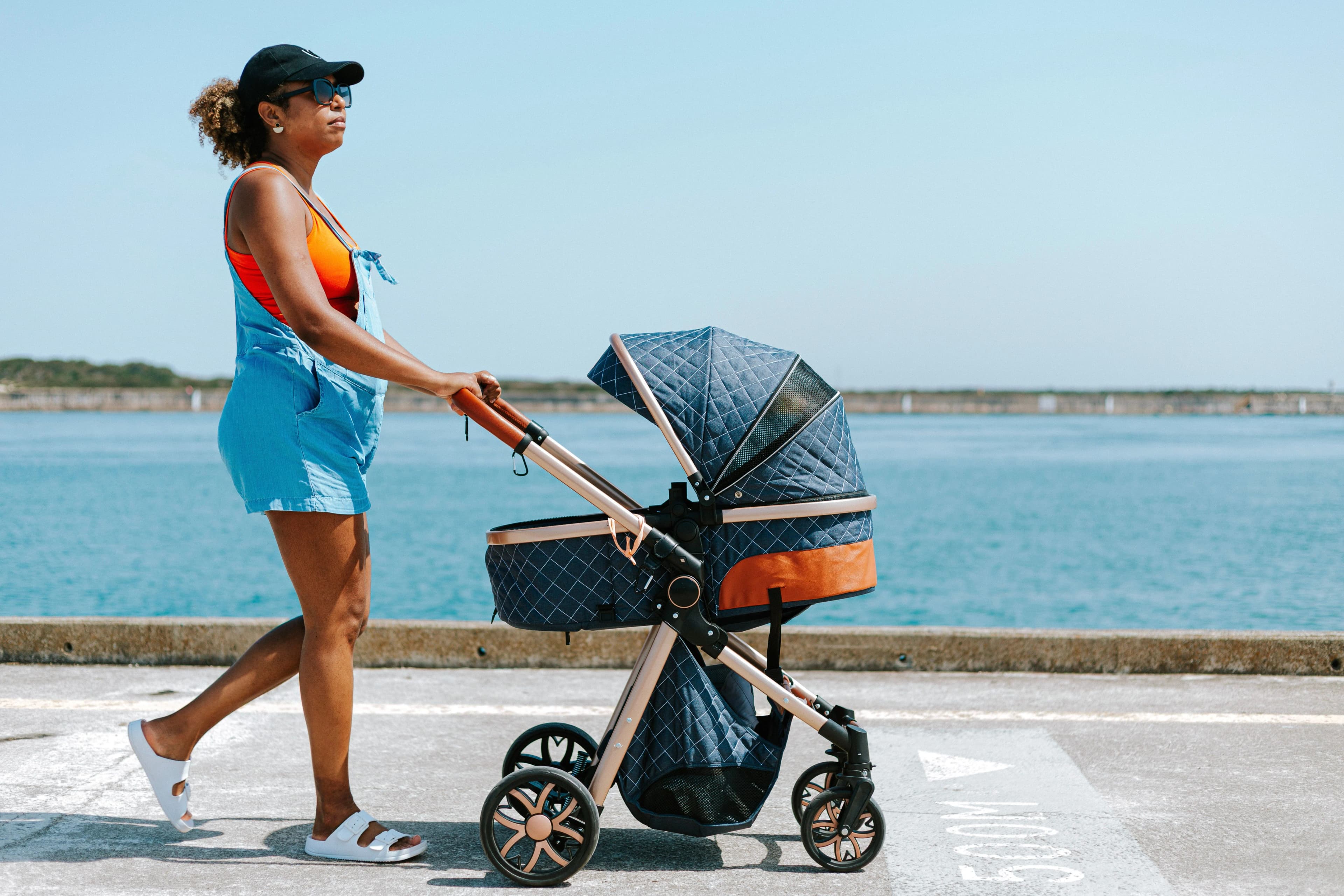 Mother and baby sharing a joyful moment outdoors — BabyCosts Australia