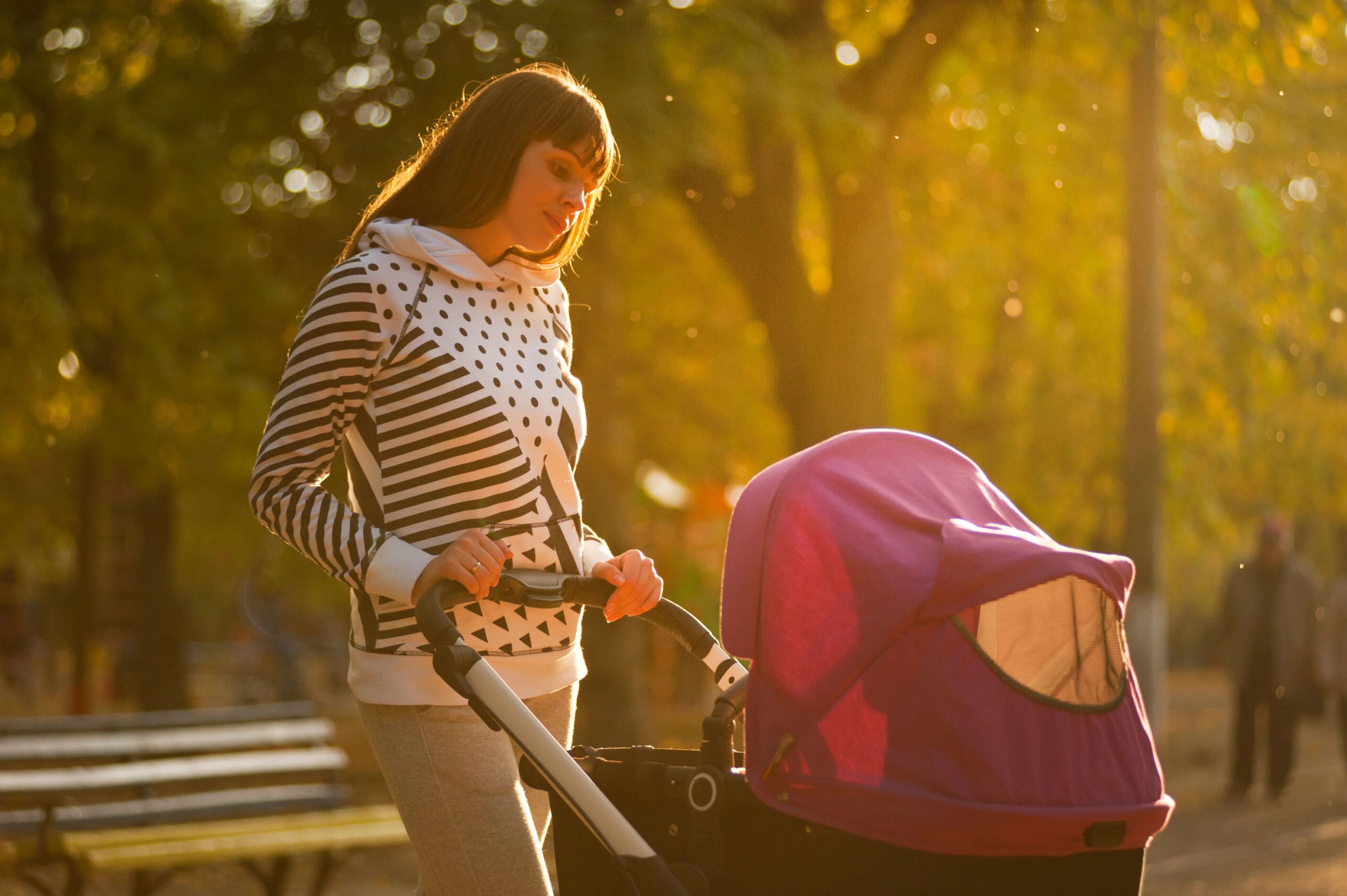 Mother and baby sharing a joyful moment outdoors — BabyCosts Australia