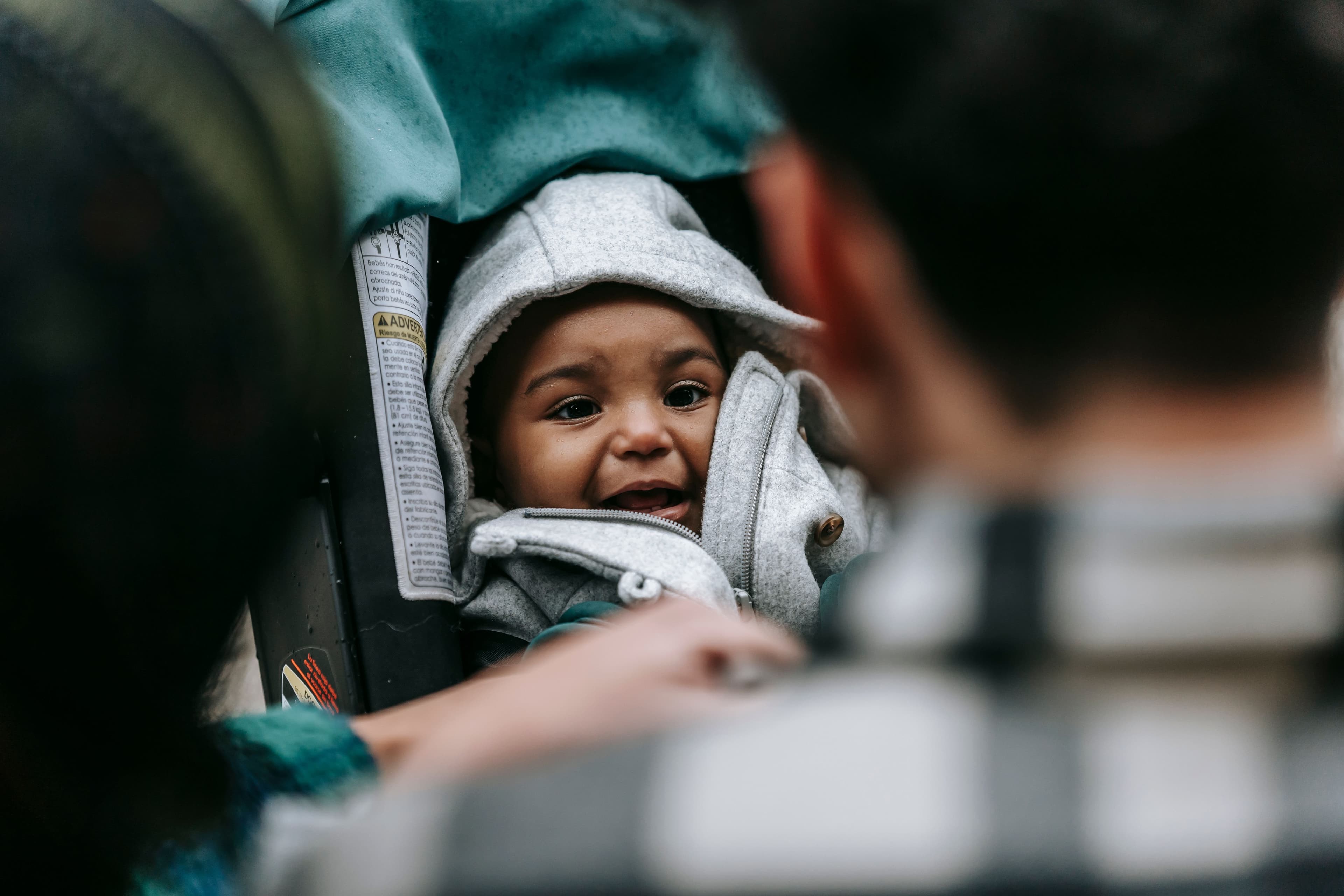 Young child sitting safely in a car seat — BabyCosts Australia