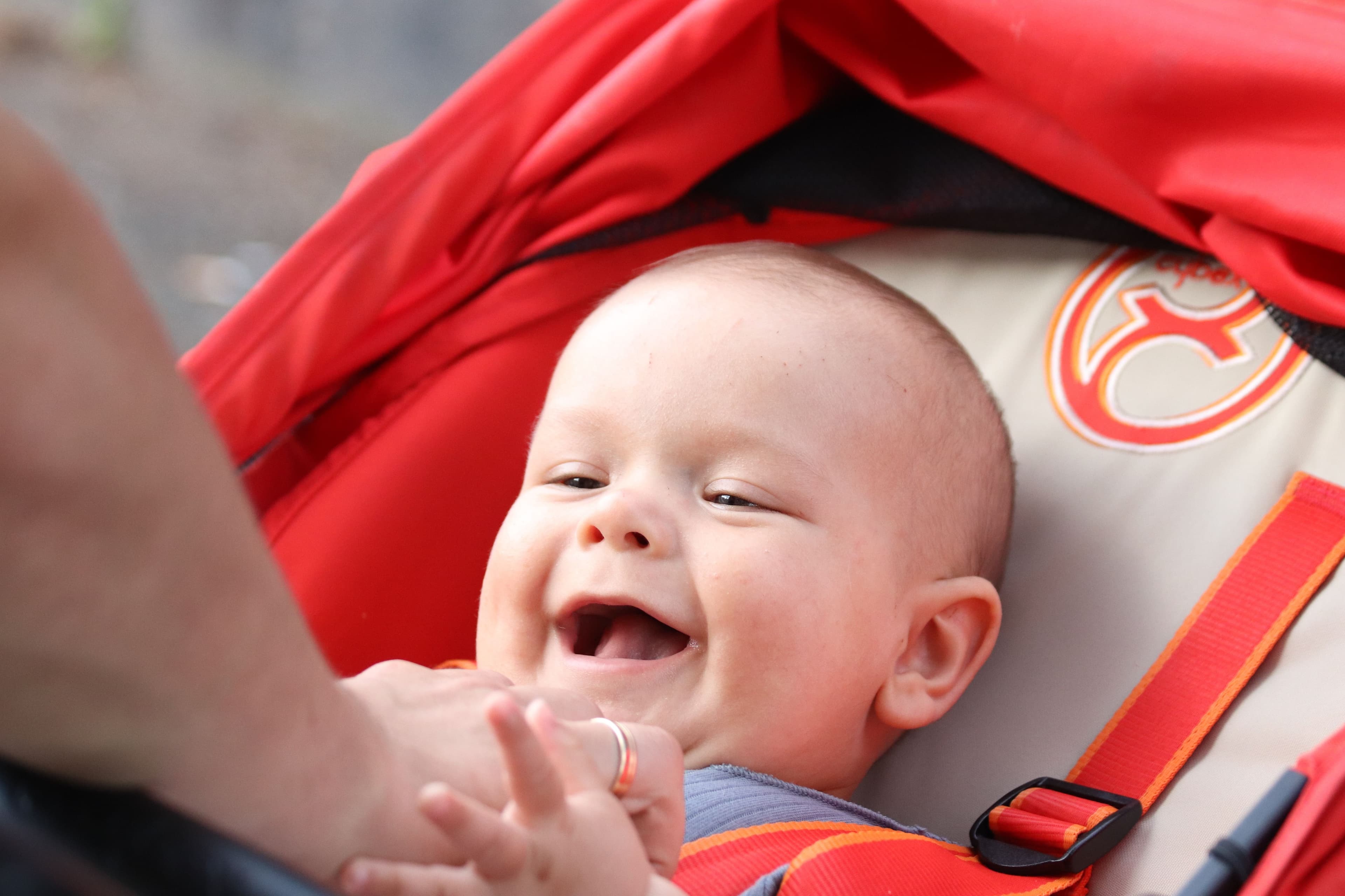Mother and baby sharing a joyful moment outdoors — BabyCosts Australia