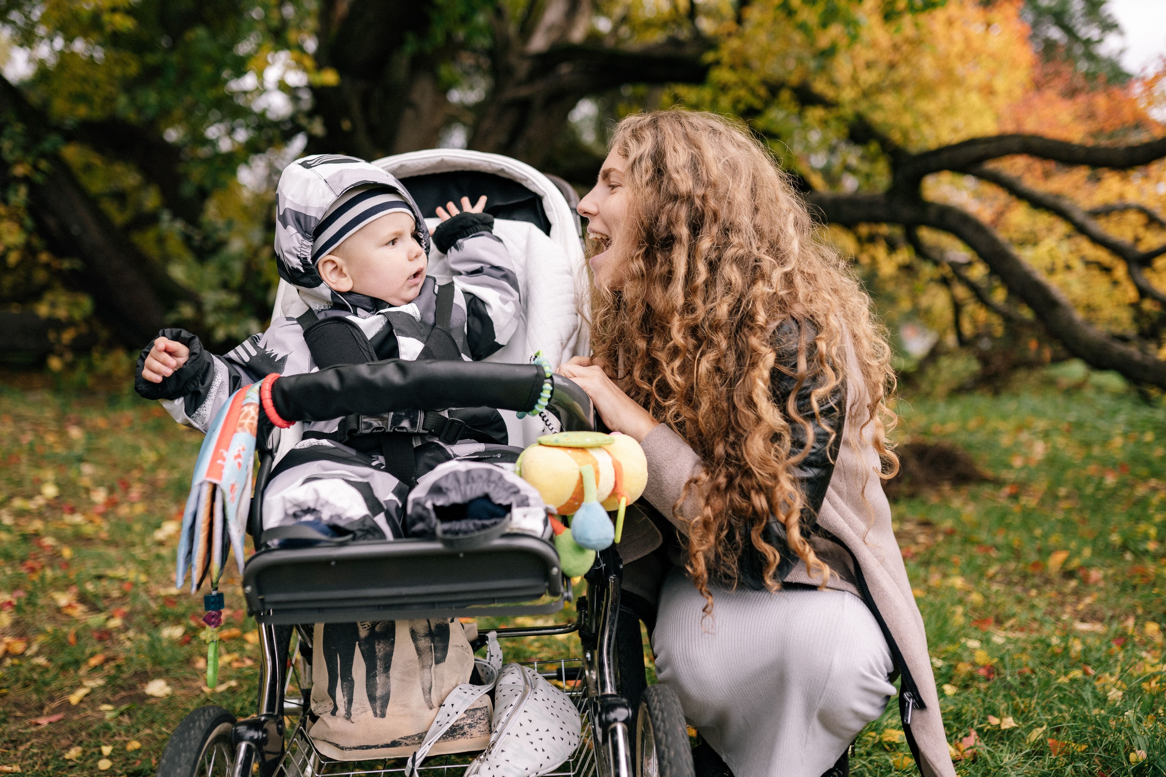 Mother and baby sharing a joyful moment outdoors